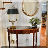 F01. Painted demilune table.  32”h x 42”w x 16”d 